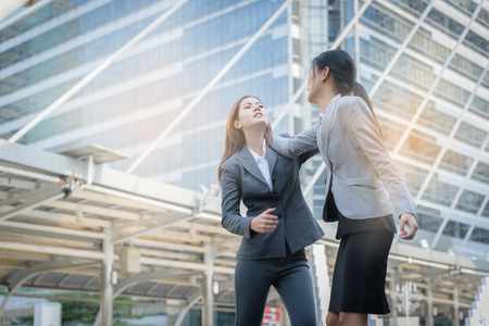 business woman group altercation when job failの写真素材