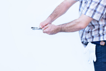 worker man standing  wiht hand holding locking pliers on white backgroundの写真素材