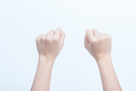 Hand women asian fist symbol isolated on white backgroundの写真素材