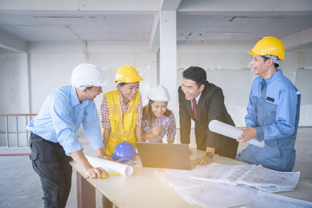 architecture engineer team meeting inside building structure with businessmanの写真素材