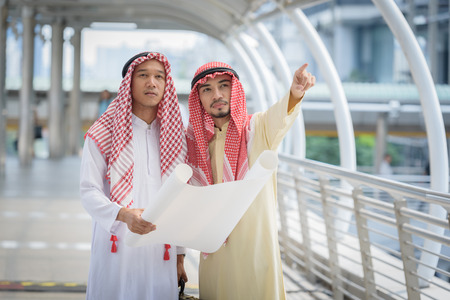 arab architecture worker man  discussion about building blueprintの写真素材