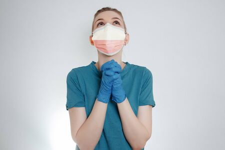 Coronavirus in Poland, Female Doctor Portrait hold protect Face surgical medical mask with Poland National Flag. Illness, Virus Covid-19 n Poland, concept photo. Europeの写真素材