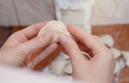 Female hands and cooking dumplings. Making dumplings. .