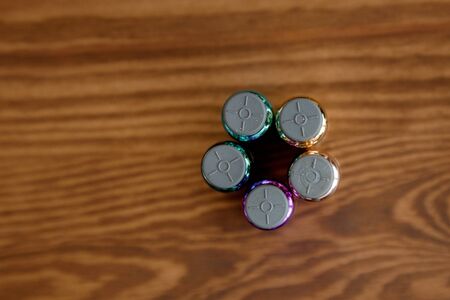 Colored bottles with rubber stoppers. The upper halves of the vials. Bottles for medicine and cosmetology.の写真素材