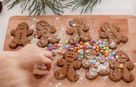 Christmas homemade gingerbread man cookies. Horizontal shot. Gingerbread Girls and Boys Dough on...