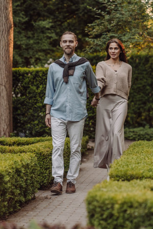 Loving young couple smiling together on nature background.の写真素材