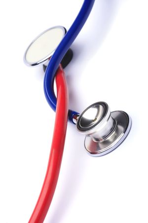 red and blue stethoscope isolated in white backgroundの写真素材