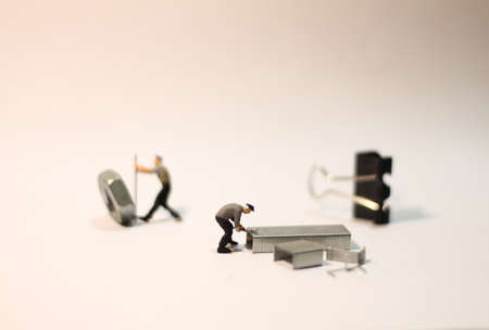 Miniatur Worker Doing Work Conceptの写真素材