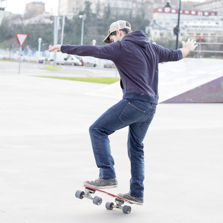 Man skateboarding in action in the skate park.の写真素材