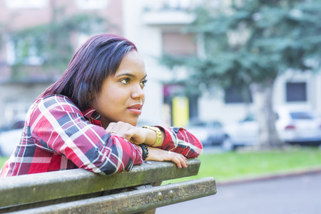 Portrait of young woman thinking, outdoor.の写真素材