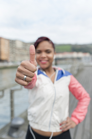 Sport whit woman smiling thumbs up gesture.の写真素材