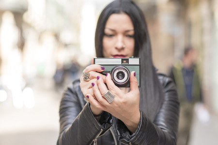 woman taking pictures With classic camera.の写真素材