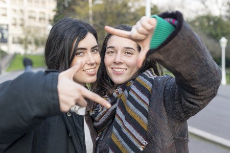 Two friends selfie woman in the street.の写真素材