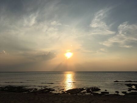 Sunset in the sky over the seaの写真素材