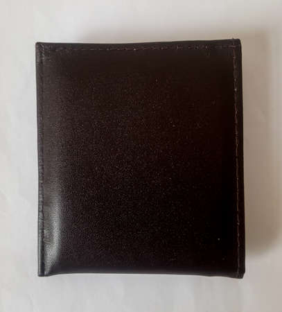 The leather wallet that I use to store money or ATM cards and others, this wallet has a smooth texture and is comfortable when put in my pocket.の写真素材