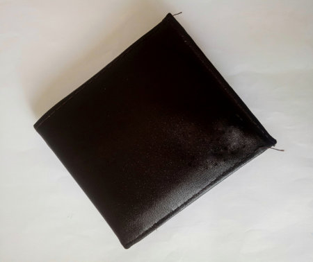 The leather wallet that I use to store money or ATM cards and others, this wallet has a smooth texture and is comfortable when put in my pocket.の写真素材