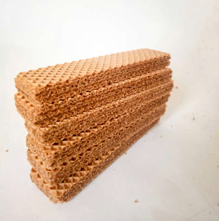 Chocolate wafer biscuits in the form of bars with a size that is not too wide, suitable to eat when watching a movie or when you are bored and want to snack on somethingの写真素材