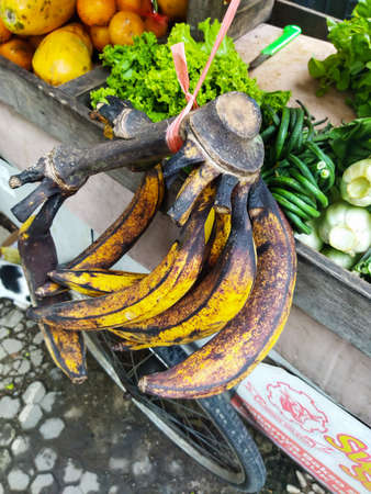Fresh bananas, suitable when eaten directly, or processed into delicious fried foods, fruit is below the market and sold by vendors in Jakarta, Indonesiaの写真素材