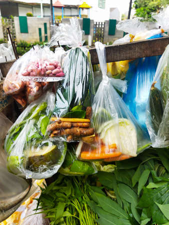Various kinds of vegetables to make soup, this is below from the market and sold by peddlers in Jakarta, Indonesiaの写真素材
