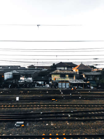 Next to the Jakarta Indonesian railroad tracks, many residents live here, this can be seen from the houses next to these train tracksの写真素材