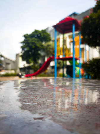 A playground for children to play, located in an apartment gardenの写真素材