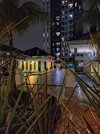 Central Jakarta, Indonesia - April 16th, 2021: The swimming pool in the apartment that is being hit by the rainのeditorial素材