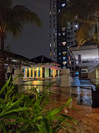 Central Jakarta, Indonesia - April 16th, 2021: The swimming pool in the apartment that is being hit by the rainのeditorial素材