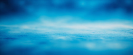 Abstract blue texture with soft gradient and blurred background.の素材