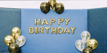 A second set of golden brown birthday balloons with a celebratory message for joyful birthday parties.の素材