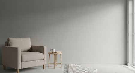 Minimalist living room with beige armchair and side table by large window.の素材