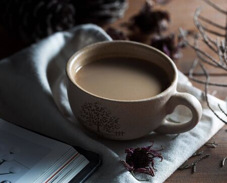 Cup of coffee on wooden tableの写真素材