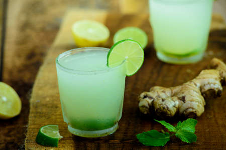 fresh lemonade on wooden base.(lemonade)の写真素材