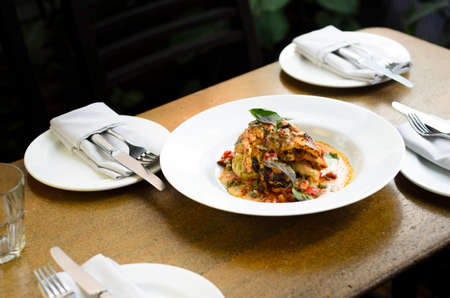 blackened char-grilled cottage cheese  on pot roasted stuffed cabbage rollsの写真素材