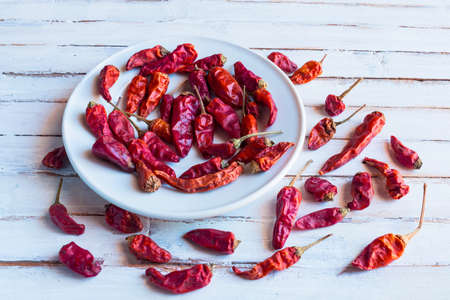 Cayenne pepper on old wooden white  background.の写真素材