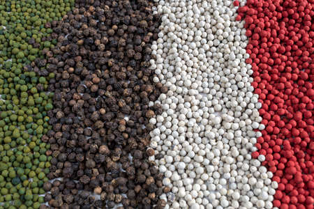Multicolored peppercorns background  Green, black, white and red peppercorns.の写真素材