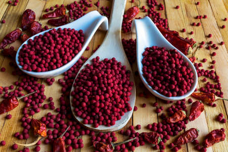 Cayenne and pepper on wooden background.の写真素材