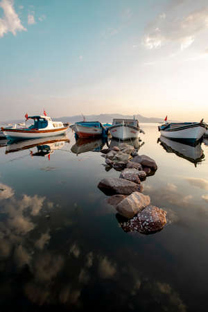 Fishing boats at sunset in the seaのeditorial素材