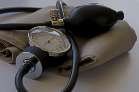 Sphygmomanometer measuring instrument on white background; Stethoscope