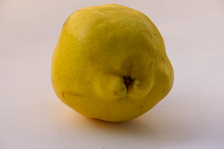 Natural quince on a white background.