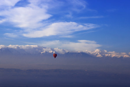 Turkey - Natural wonders in Denizli, Pamukkale travertines and balloons carrying people.の写真素材