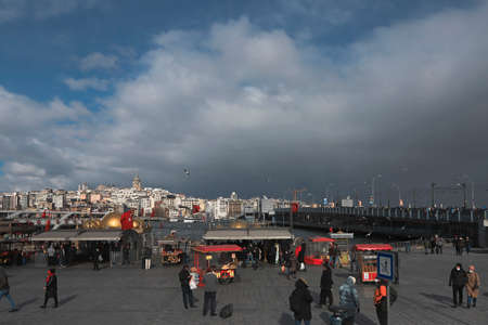 (Istanbul - Turkey 16.February.2021) - EminÃ¶nÃ¼ square is a popular place in Istanbul. Peddlers and people.のeditorial素材