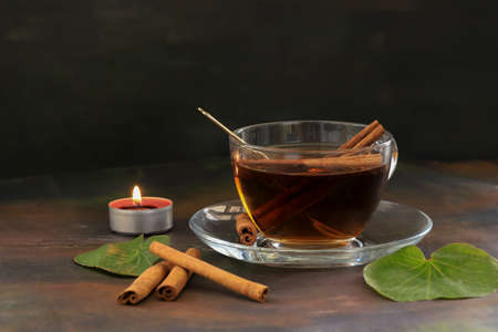 aromatic hot cinnamon tea on wooden tableの写真素材