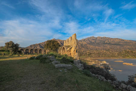 rock tombs , latmos ancient city - KapÄ±kÄ±rÄ± village - Lake Bafaの写真素材