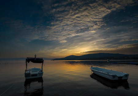 Dikili -Izmir - Turkey 15.August 2021 Boats on the sea in Bademli neighborhood at sunsetのeditorial素材
