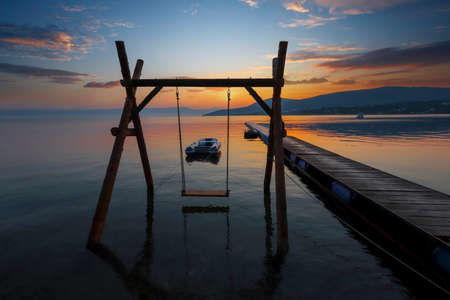 Dikili -Izmir - Turkey 15.August 2021 Boats on the sea in Bademli neighborhood at sunset