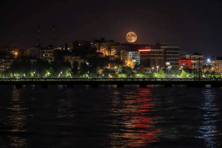 Moonrise on September 21, 2021 over the BayraklÄ± district of Izmir - Turkeyのeditorial素材