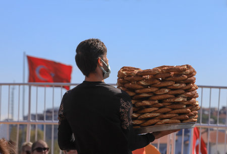 ISTANBUL, Turkey - October 05, 2021. Bagel sellers on the Adalar ferry. Traditional Turkish pastry seller.のeditorial素材