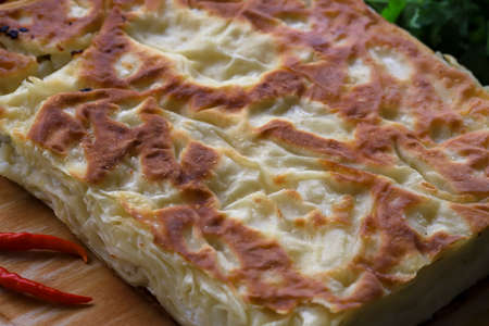Su Borek - Turkish Borek on wooden surface.