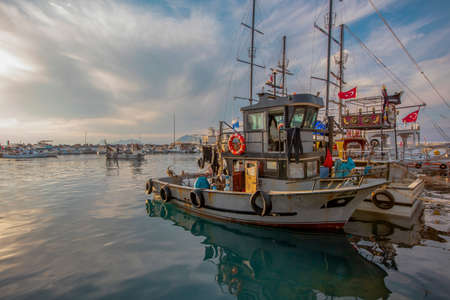 Turgutreis - Bodrum- MuÄla-Turkey - November 15, 2021: Turgutreiste, one of the most popular touristic places of the Aegean region, is the harbor with fishing boats.のeditorial素材