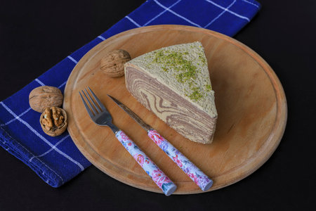 black background. Chocolate halva on wood.